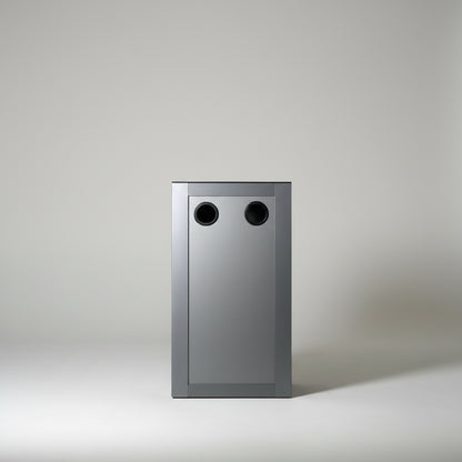 Modern gray cabinet with two circular handles against a white wall.