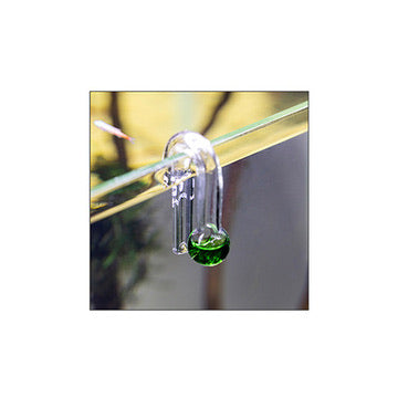 Glass hanging drop checker with green solution on side of aquarium tank